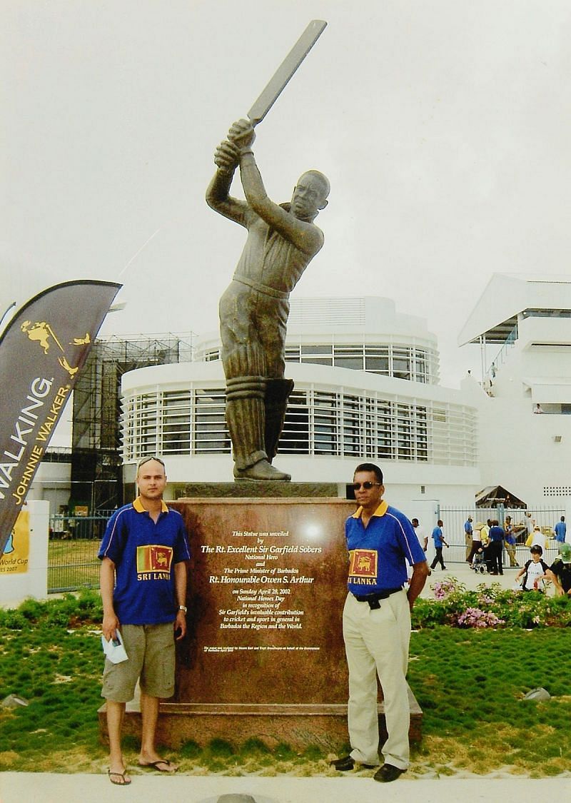 Snap with the greatest: My friend, Adrian (left) and yours truly standing before the statue of Sir Garfield Sobers at the Kensington Oval in Bridgetown, Barbados prior to the start of the 2007 ICC Cricket World Cup final on 28 April 2007. (© Ranjan Mellawa)