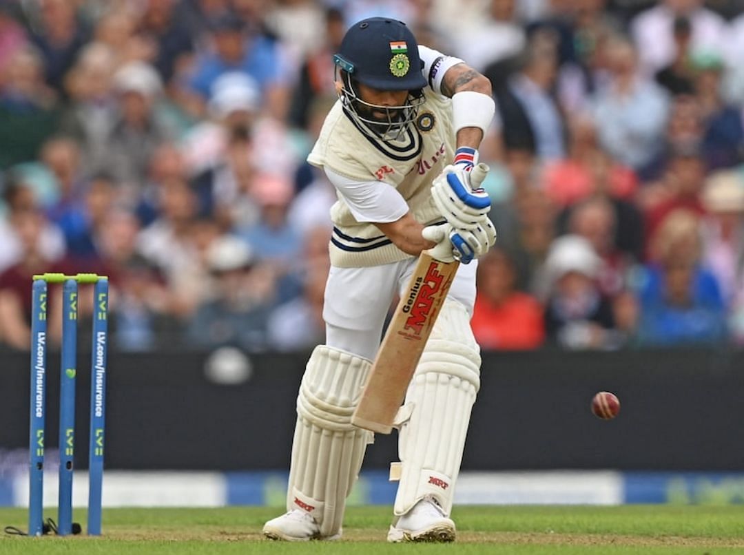 Virat Kohli defending the ball on the front foot