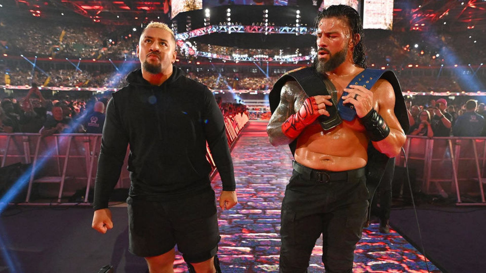 Solo Sikoa (left) and Roman Reigns (right)