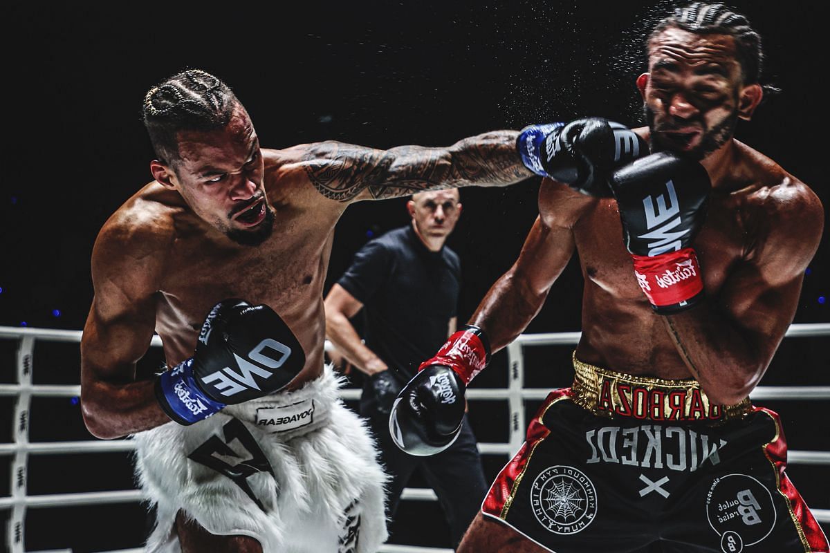 Regian Eersel connects with a straight left on Alexis Nicolas.
