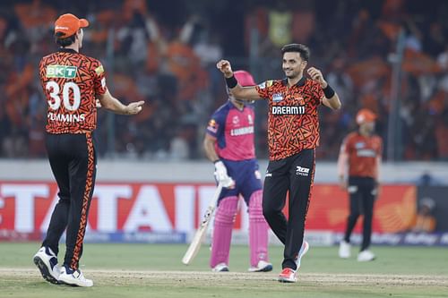 Harshal Patel (R) celebrates a wicket - Source: Getty