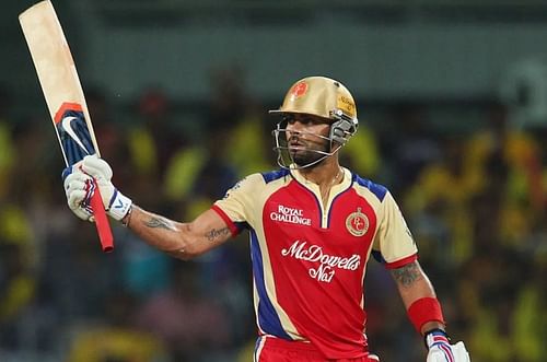 Virat Kohli raising his bat after a 50 vs CSK [Getty Images]