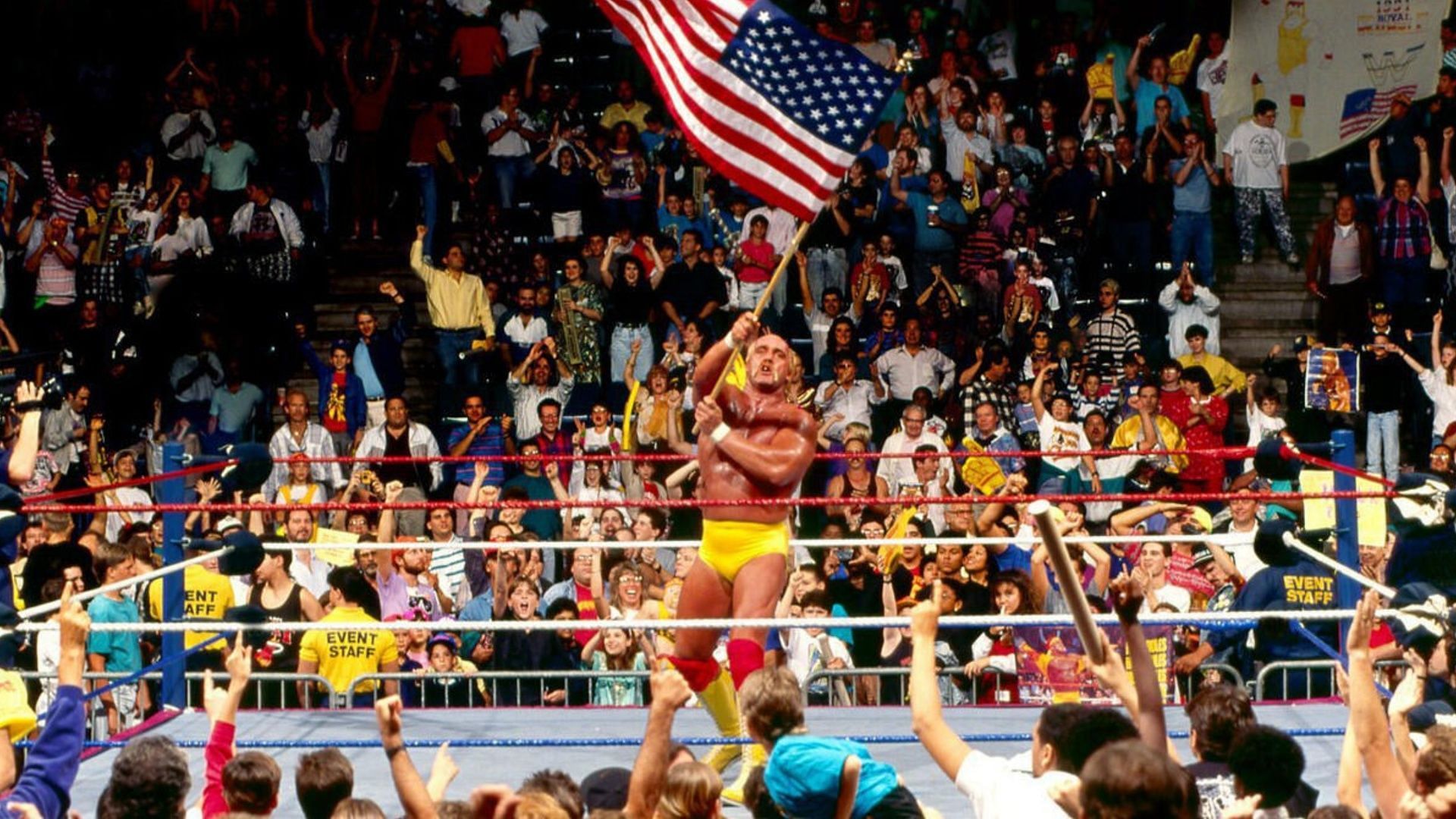 Hulk Hogan waves the American flag at a WWE event  (Image via WWE.com).