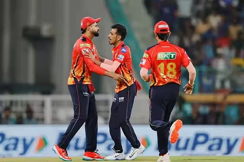 Yuzvendra Chahal (center) had Nicholas Pooran caught by Glenn Maxwell at long-off. [P/C: iplt20.com]