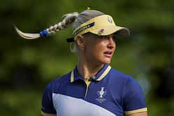 Charley Hull sports a yellow and blue outfit on the range ahead of the U.S. Women's Open 2025