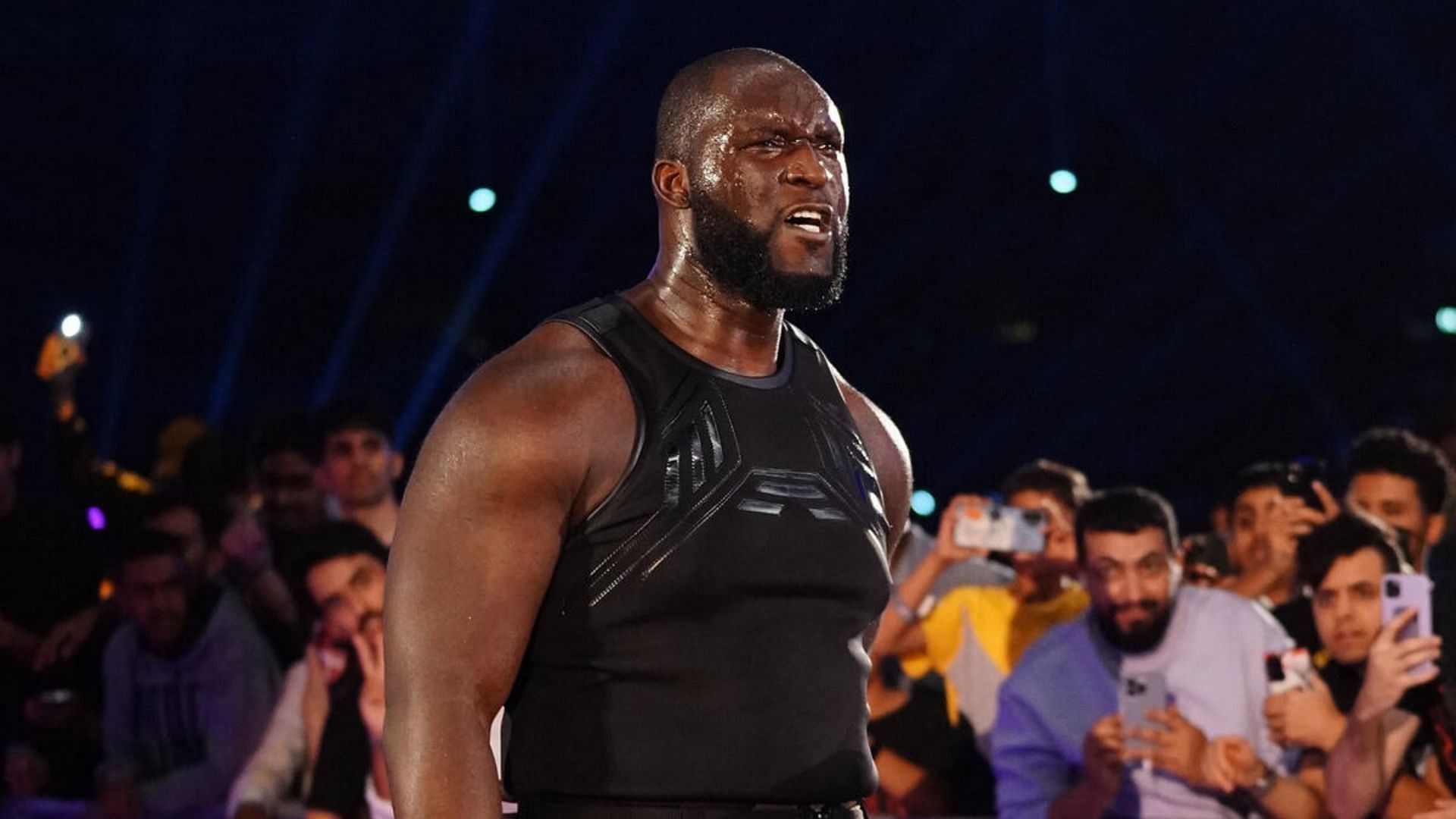 Omos is a former Tag Team Champion. [Image via - WWE.com]