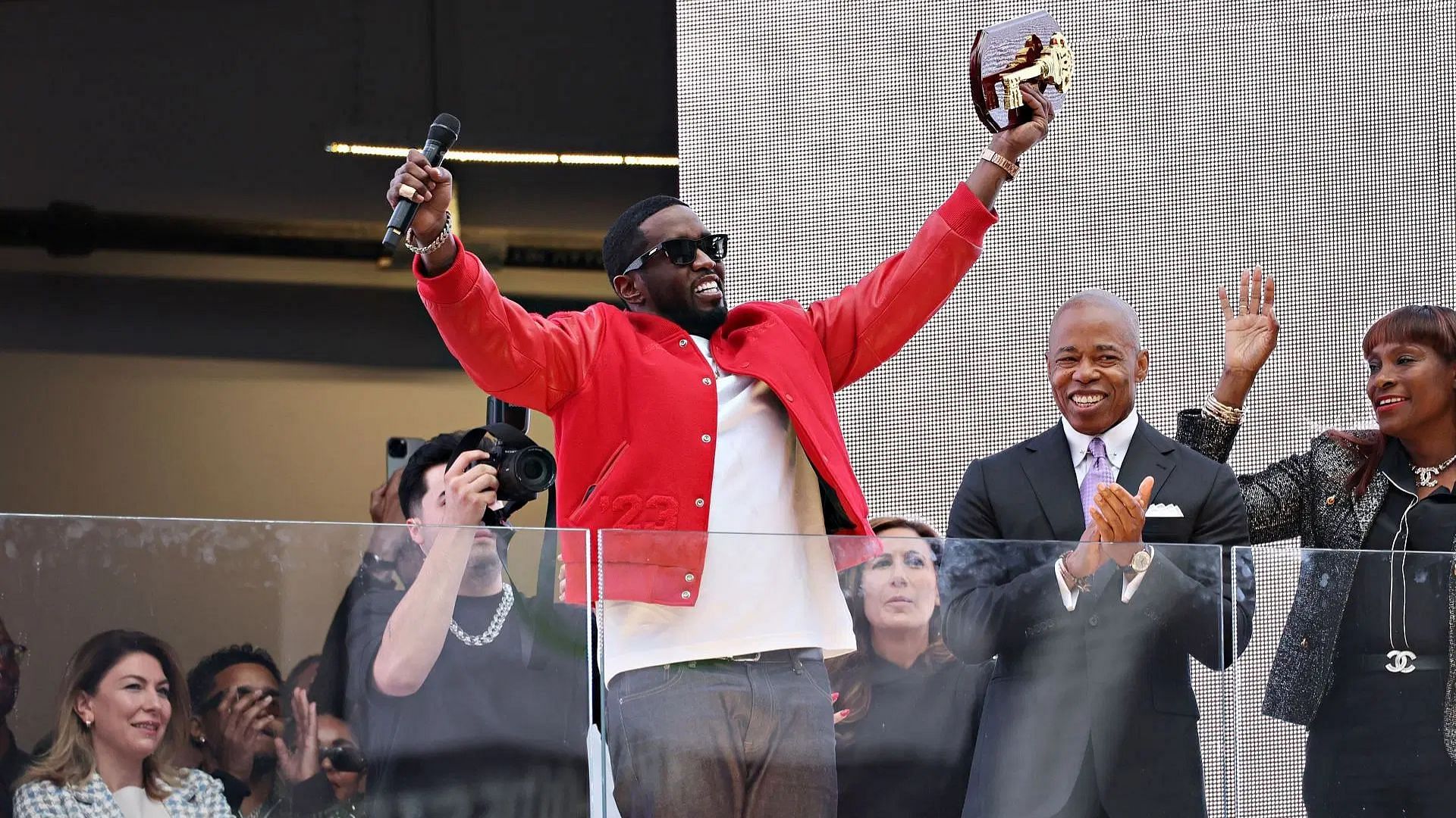 New York Mayor Eric Adams (R) presents Sean &quot;Diddy&quot; Combs with the keys to the city in Times Square (Image via Getty)