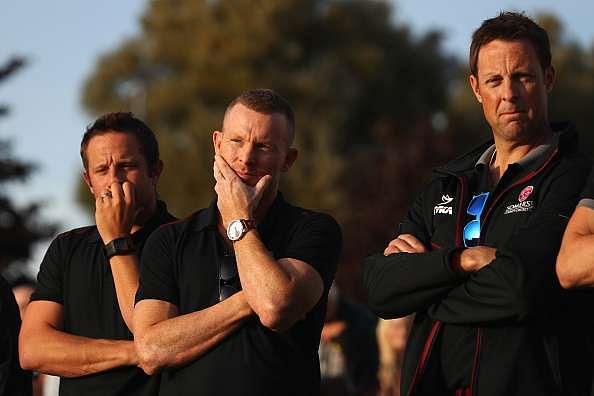 SOMERSET, UNITED KINGDOM - SEPTEMBER 23: A dejected Chris Rogers (C) the captain of Somerset alongside a tearful Roelof van der Merwe (L) and Marcus Trescothick (R) at a team presentation following the conclusion of the match deciding the title between Middlesex and Yorkshire at The Cooper Associates County Ground on September 23, 2016 in Somerset, United Kingdom. (Photo by Michael Steele/Getty Images)